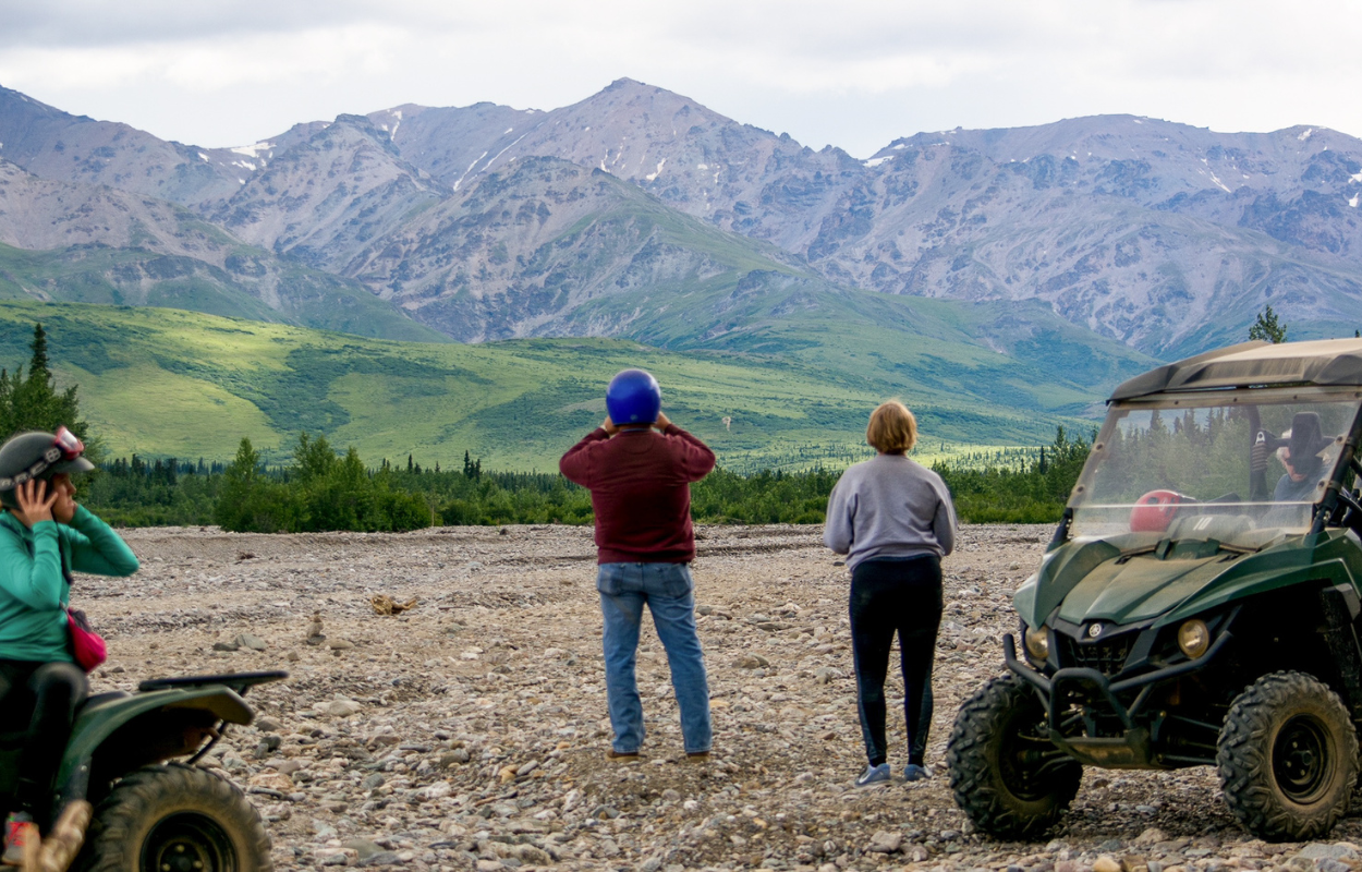 two people looking at a mountain